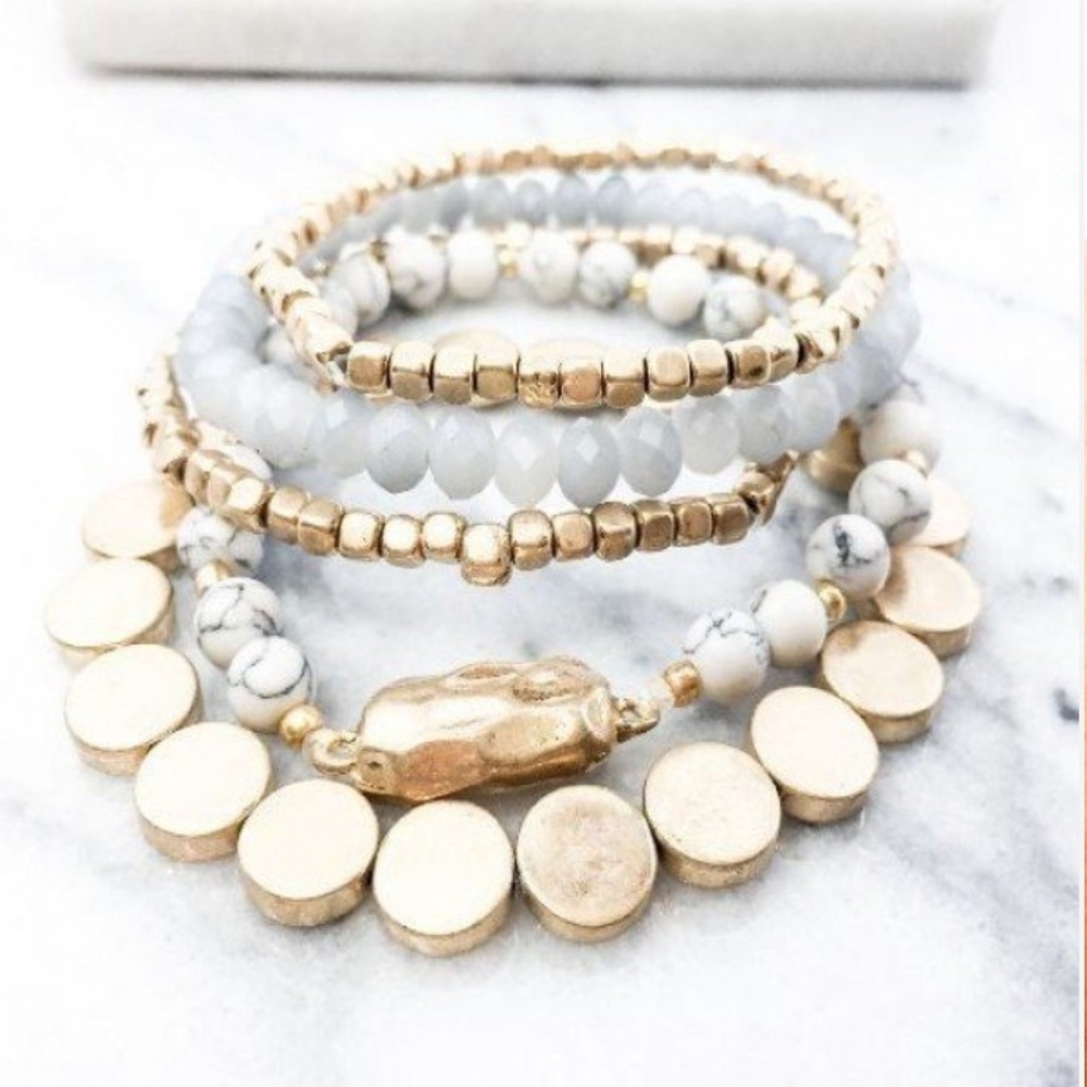 White and gold 5 strand bracelet.